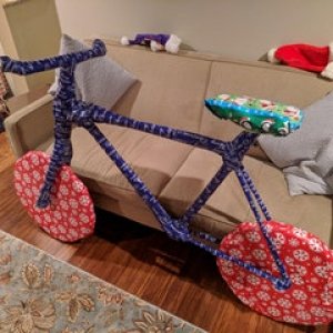 Bought my brother tree trimmers for Christmas, built a cardboard frame around them and wrapped them like this. • r/pics