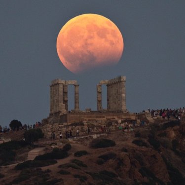 AP Images on Instagram: “The August full moon rises above the 5th Century BC Temple of Poseidon at Cape Sounio, south of Athens, on Monday, Aug. 7, 2017. More than…”