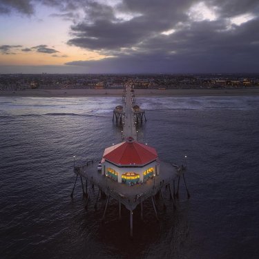 Micah Fitch on Instagram: “Gloom of Hope #aerialphotography #pier #huntingtonbeach #gloom #grey #sunrise”