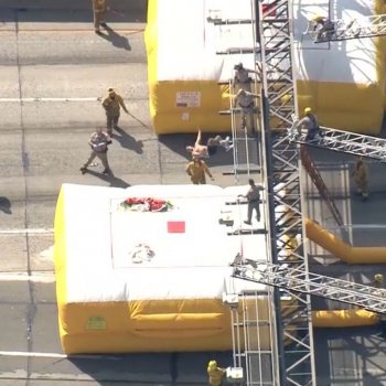CBS Los Angeles on Instagram: “WATCH: A protester who climbed a 110 Fwy sign ends a tense standoff by doing a backflip onto an inflatable landing pad below. The man was…”